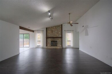 Large great room with impressive stone fireplace a