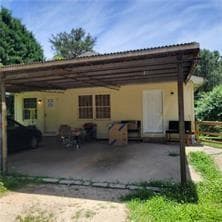 Rear view of property featuring a carport