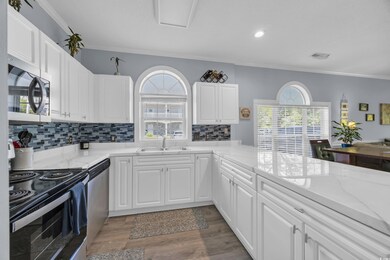 Kitchen featuring crown molding, appliances with s