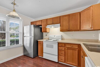 Kitchen with hanging light fixtures, stainless ste