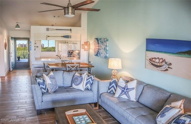 Living area with wood finished floors and a ceilin