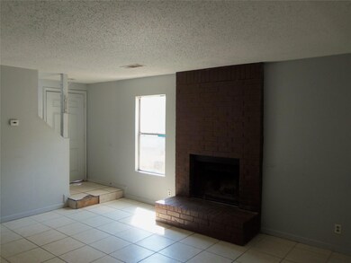 Unfurnished living room with a textured ceiling, 