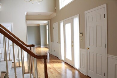 Foyer - gleaming wood floors lead you into the oth