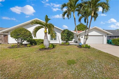 Ranch-style house with a front lawn and a garage