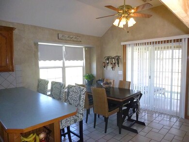 Patio and backyard access from the informal dining