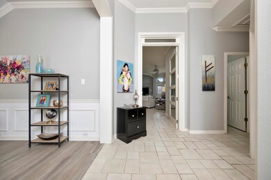 Hallway featuring light wood-style flooring, ornam
