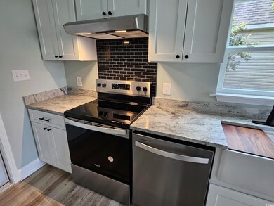 Whirlpool range and dishwasher with tile back behi