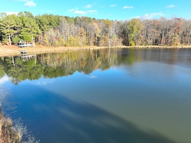 Water view featuring a heavily wooded area