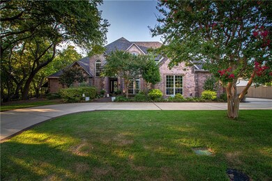 House set on a creek lot, beautiful trees!