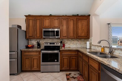 Beautiful Kitchen with Granite Counter Tops and 42 inch cabinets