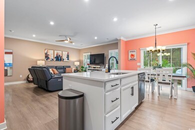 Kitchen featuring sink, an island with sink, penda
