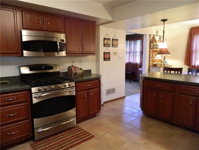 Cabinets under the breakfast bar allow for additio