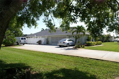 Right side showing 3 car garage, and boat/rv pad