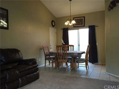 Dining area sliding door opens up to small outdoor