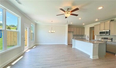 Kitchen featuring stainless steel appliances, ligh