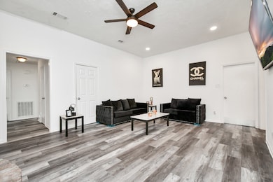 Modern dark wood laminate flooring, recessed light