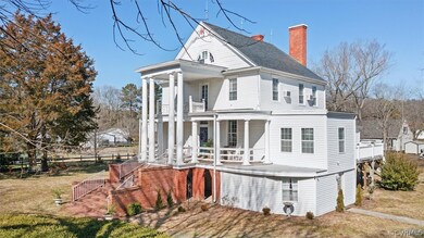 Rear view of house featuring covered porch