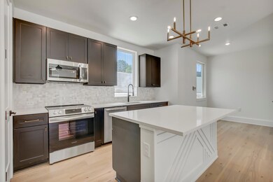 Kitchen featuring appliances with stainless steel