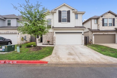 View of front of house with driveway, a garage, a