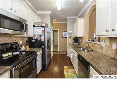 Stainless steel appliances  -  Hardwood floors  - 