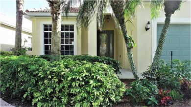 Under truss entry features a lead glass door to let the Florida sunshine in!