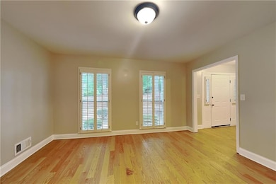 Empty room featuring light wood-style flooring