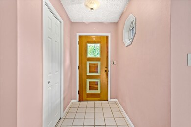 The entrance of the home has a nice size coat clos