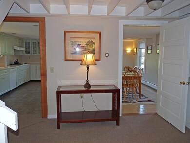 Foyer showing kitchen to the left,...