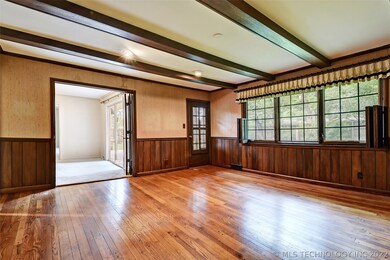 WOOD BEAMED CEILING, OPEN TO THE DINING WITH A DOO
