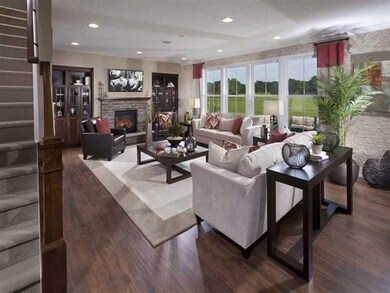 Great Room. Photo is of a similar model & floor plan.