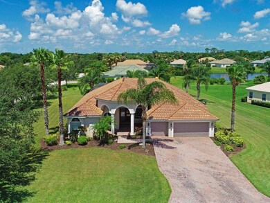Expansive .71 acre yard with palms, pond view and 