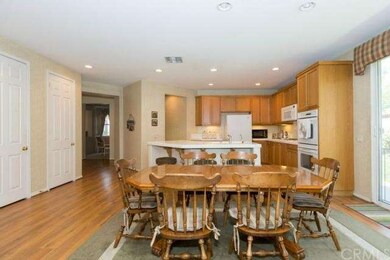 Open floor plan concept with large area to eat in the kitchen that opens to the family room and nice slider that leads to the large side yard.