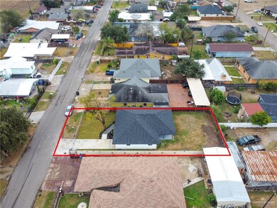 Aerial view of residential area with property boundaries highlighted