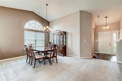 Opposite view of the dining room and a view of the entry. To the right is the stair case leading to the upper bonus room.