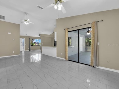 Sliders open to the great room and the pass through window to the kitchen for easy entertaining....