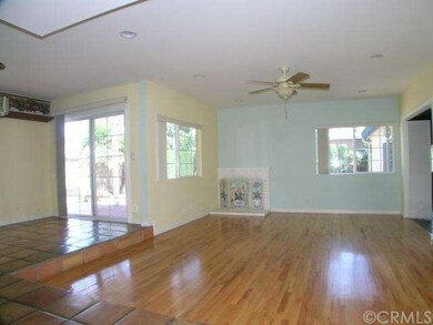 Refinished hardwood with porcelain tile floors