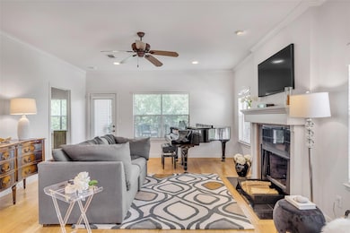 Living area with a fireplace, light wood finished