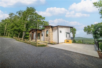 View of home's exterior featuring stone siding and stucco siding
