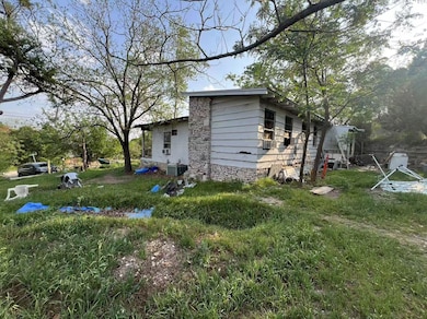 View of property exterior featuring stone siding 