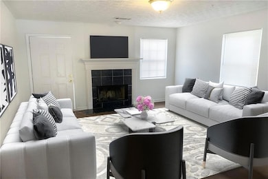 Living area featuring wood finished floors, a tile