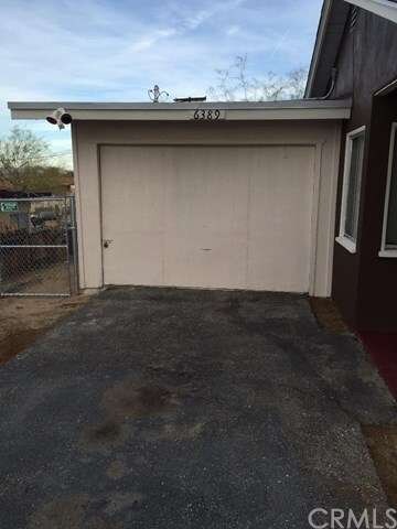 Attached Garage with Security Lighting.