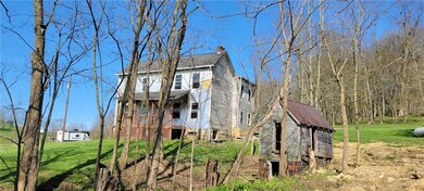 This view shows the spring house and the back and