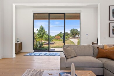 Living area with wood finished floors and baseboards