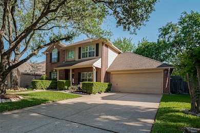 This classic two-story brick home has an inviting