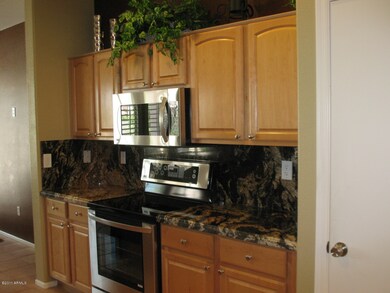 GRANITE COUNTERS W FULL BACKSPLASH