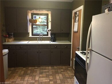 Airy kitchen with view of back yard.