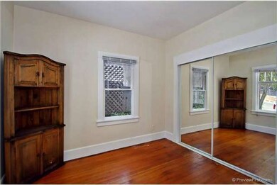 Nice wood floors and mirrored closet doors.