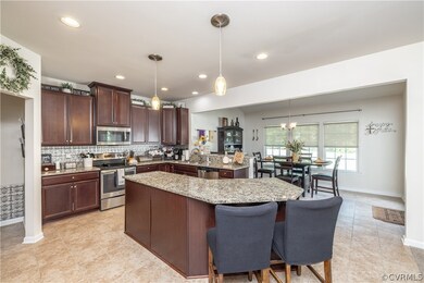 The kitchen is huge and features granite counterto