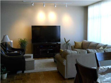 Large living room with floor to ceiling windows