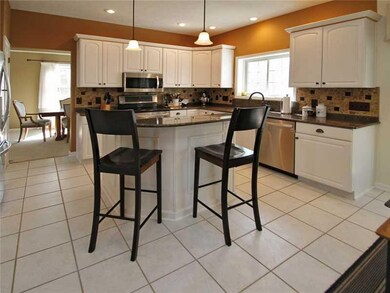 Kitchen. Gourmet Kitchen features granite counters, oversized breakfast island, tile backsplash, 42